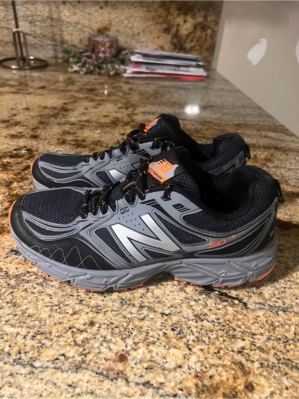 New Balance Men’s Black and Gray Athletic Trail Shoes with Orange Accents